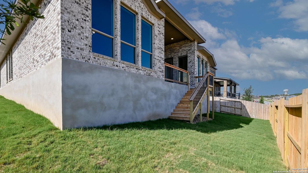 Front exterior of a new home in Homestead 65', Schertz, TX, highlighting curb appeal (Image 2). Front exterior of a new home in Homestead 65', Schertz, TX, highlighting curb appeal (Image 2).