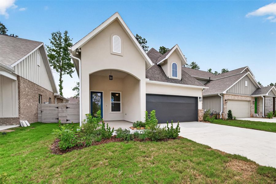 Front exterior of a new home in Two Step Farm, Montgomery, TX, highlighting curb appeal (Image 1). Front exterior of a new home in Two Step Farm, Montgomery, TX, highlighting curb appeal (Image 1).