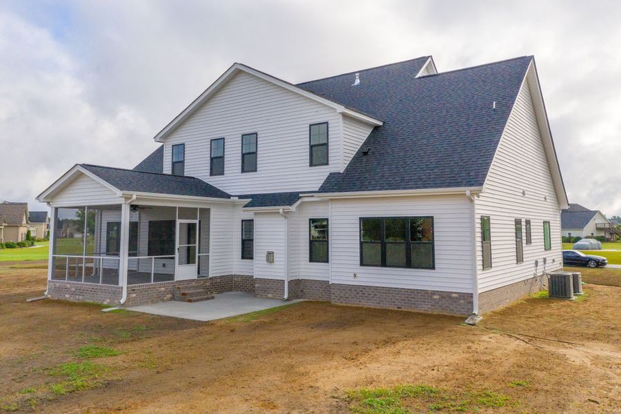 Representative exterior photo of a completed home built from the Carson by Bill Clark Homes in Cheshire Landing, Grimesland, NC (Image 31). Representative exterior photo of a completed home built from the Carson by Bill Clark Homes in Cheshire Landing, Grimesland, NC (Image 31).