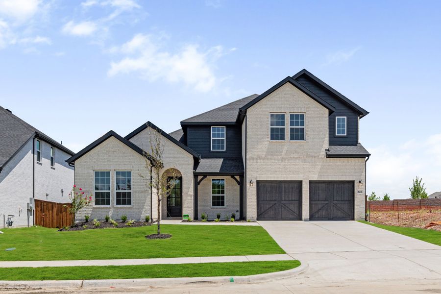 Representative exterior photo of a completed home built from the Whitney by UnionMain Homes in Edgewater, Fate, TX (Image 4). Representative exterior photo of a completed home built from the Whitney by UnionMain Homes in Edgewater, Fate, TX (Image 4).