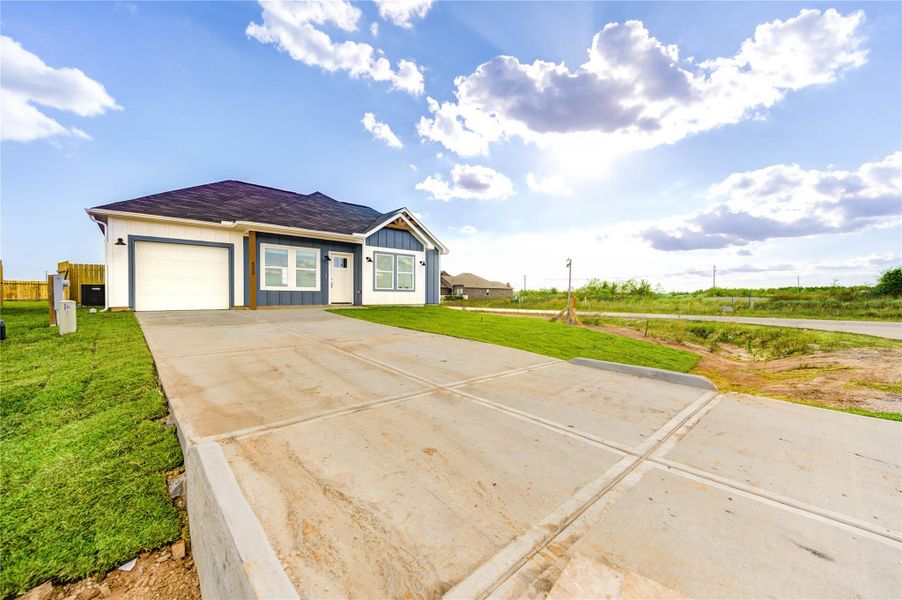 Front exterior of a new home in , Cleveland, TX, highlighting curb appeal (Image 2).