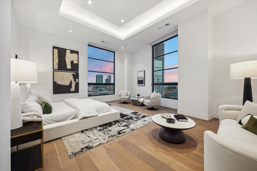 This magazine-worthy primary bedroom exudes luxury and tranquility, featuring two floor-to-ceiling windows that flood the space with natural light and offer captivating views. This magazine-worthy primary bedroom exudes luxury and tranquility, featuring two floor-to-ceiling windows that flood the space with natural light and offer captivating views.