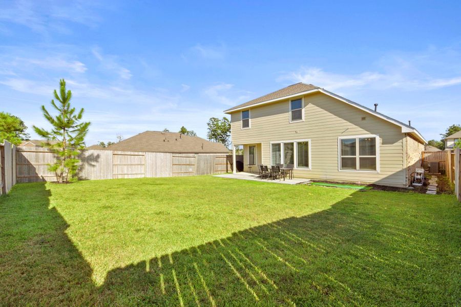 Front exterior of a new home in , Conroe, TX, highlighting curb appeal (Image 20).