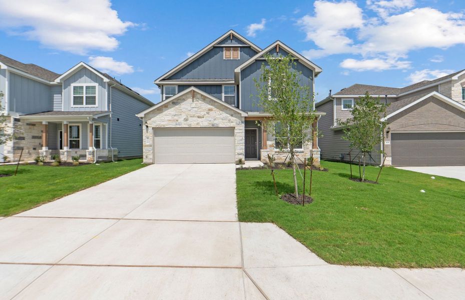 Front exterior of a new home in Patterson Ranch, Georgetown, TX, highlighting curb appeal (Image 20). Front exterior of a new home in Patterson Ranch, Georgetown, TX, highlighting curb appeal (Image 20).