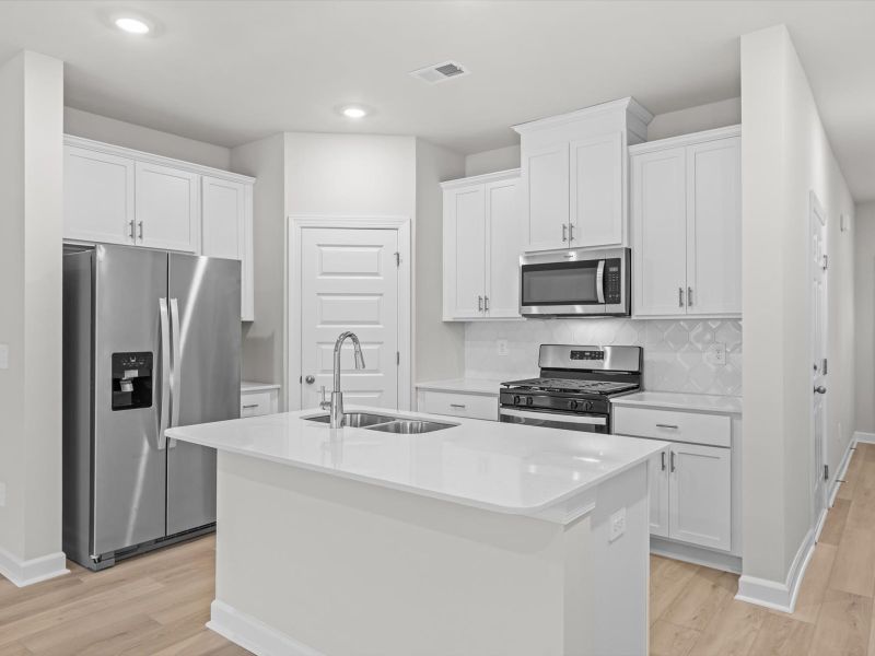Furnished interior view inside a new home in Crossing at Abner Creek Townes, Greer (Image 4).