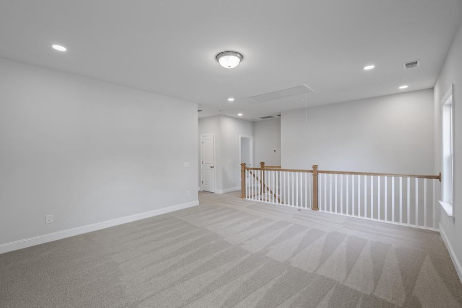 Spacious, unfurnished interior of a new home in K. Hovnanian's® Four Seasons at Lakes of Cane Bay, Summerville (Image 18).