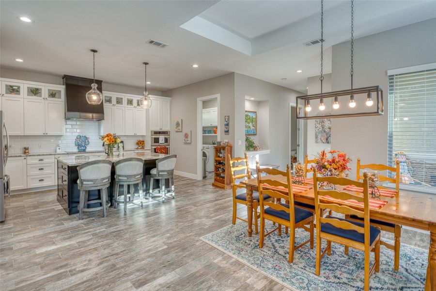 Dining space featuring recessed lighting, light wood finished floors, and washer / dryer