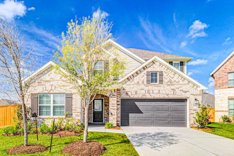 Front exterior of a new home in Marvida, Cypress, TX, highlighting curb appeal (Image 1). Front exterior of a new home in Marvida, Cypress, TX, highlighting curb appeal (Image 1).