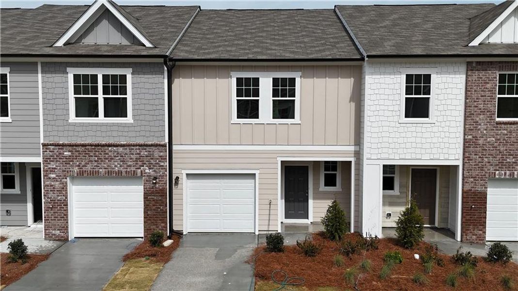 Front exterior of a new home in Kingston Cove, Auburn, GA, highlighting curb appeal (Image 6).