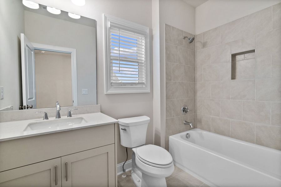 Representative furnished interior of a home built from the The McIntosh by The Providence Group in Promenade at Sawnee Village, Cumming (Image 13).