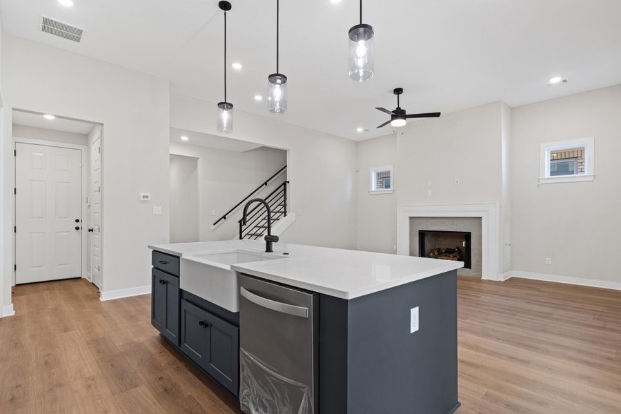 Kitchen island with farmhouse sink and stainless steel dishwasher Kitchen island with farmhouse sink and stainless steel dishwasher