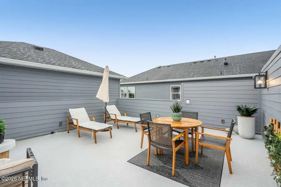 Exterior details and patio area of a home in Seven Pines 24' Rear Entry Townhomes, Jacksonville (Image 9). Exterior details and patio area of a home in Seven Pines 24' Rear Entry Townhomes, Jacksonville (Image 9).