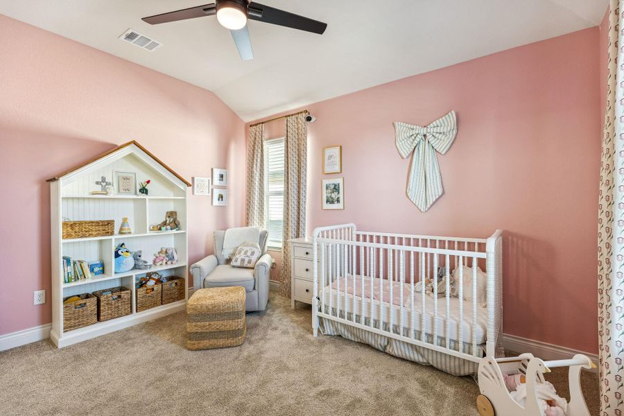 Second bedroom upstairs with ceiling fan