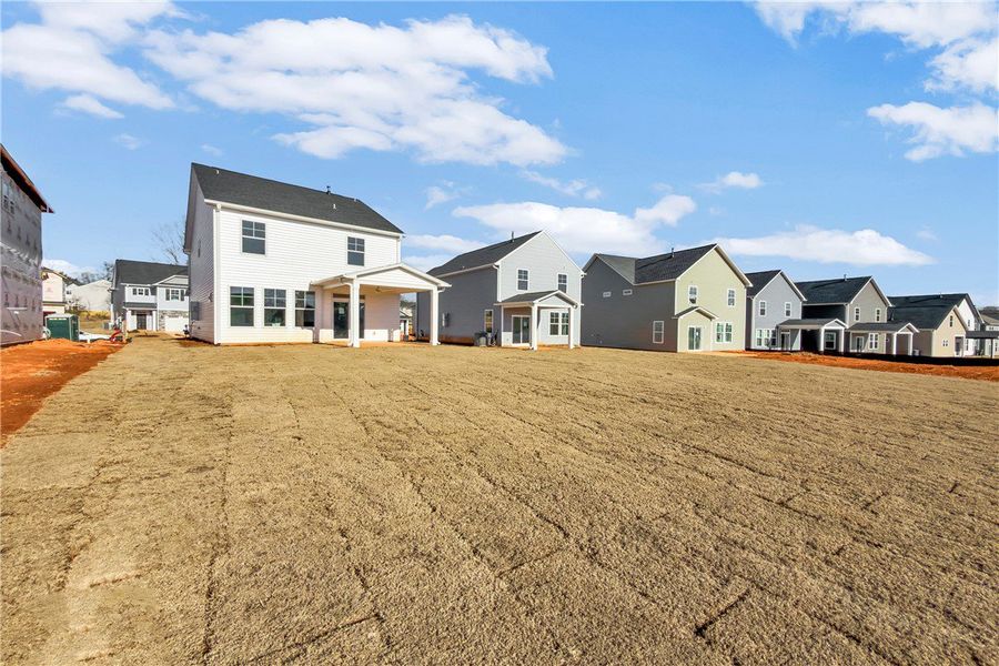 Exterior details and patio area of a home in Brownstone Park, Easley (Image 16).