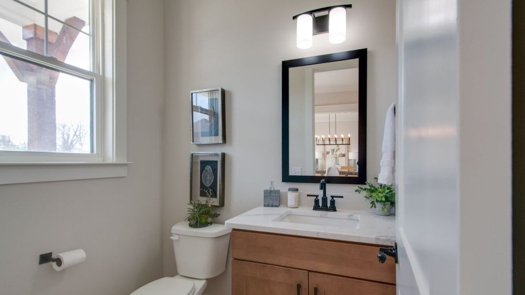 Powder room with toilet and vanity Powder room with toilet and vanity