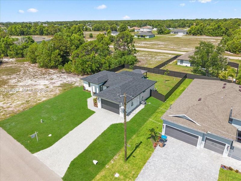 Front exterior of a new home in , Cape Coral, FL, highlighting curb appeal (Image 1). Front exterior of a new home in , Cape Coral, FL, highlighting curb appeal (Image 1).