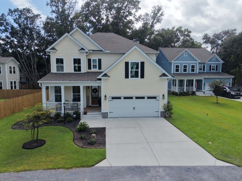 Front exterior of a new home in Overlook at Copahee Sound, Awendaw, SC, highlighting curb appeal (Image 2). Front exterior of a new home in Overlook at Copahee Sound, Awendaw, SC, highlighting curb appeal (Image 2).