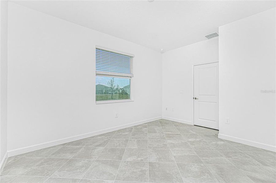 Spacious, unfurnished interior of a new home in Island Lakes at Coco Bay: Villas, Englewood (Image 22).