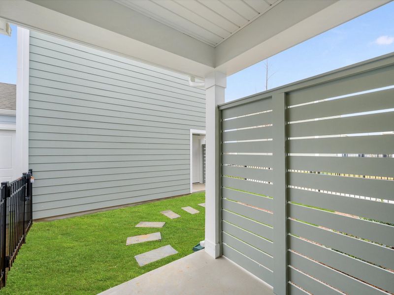 Exterior details and patio area of a home in North Creek Village - Townhomes, Huntersville (Image 4).
