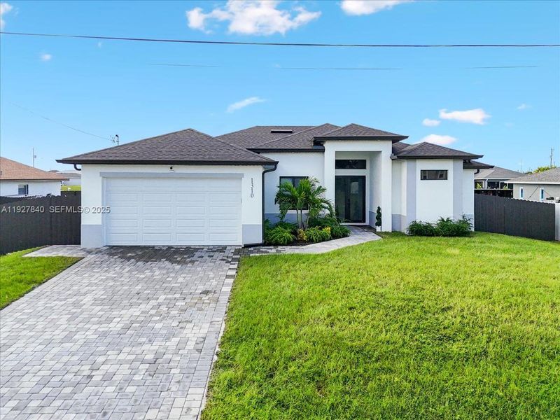 Front exterior of a new home in , Cape Coral, FL, highlighting curb appeal (Image 22). Front exterior of a new home in , Cape Coral, FL, highlighting curb appeal (Image 22).