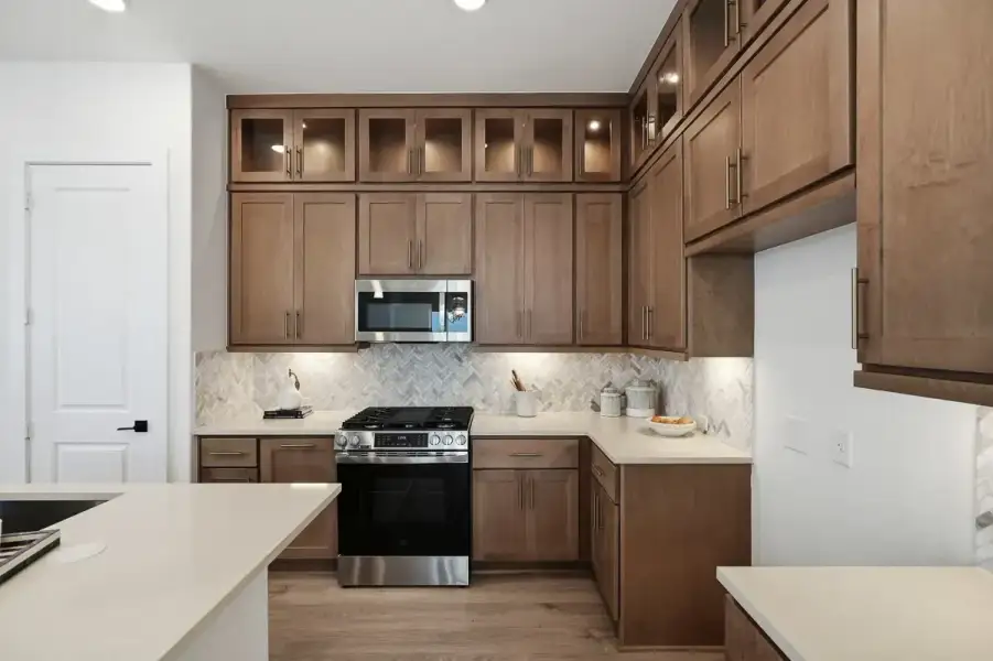 Representative furnished interior of a home built from the Calypso by Chesmar Homes in Centero at Stone Oak, San Antonio (Image 9).