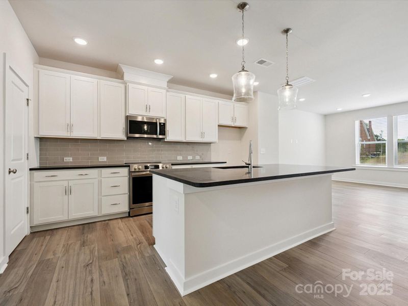 Furnished interior view inside a new home in Central Living at Craig, Charlotte (Image 10).
