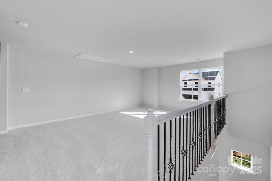 Spacious, unfurnished interior of a new home in Redhawk: Walk, Belmont (Image 27).