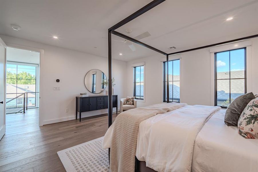 Bedroom featuring wood finished floors, recessed lighting, and ceiling fan Bedroom featuring wood finished floors, recessed lighting, and ceiling fan