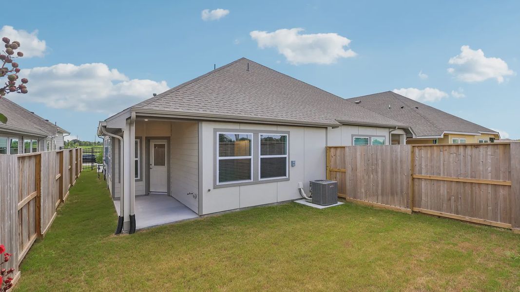 Exterior details and patio area of a home in Meridiana Townhomes, Iowa Colony (Image 4).