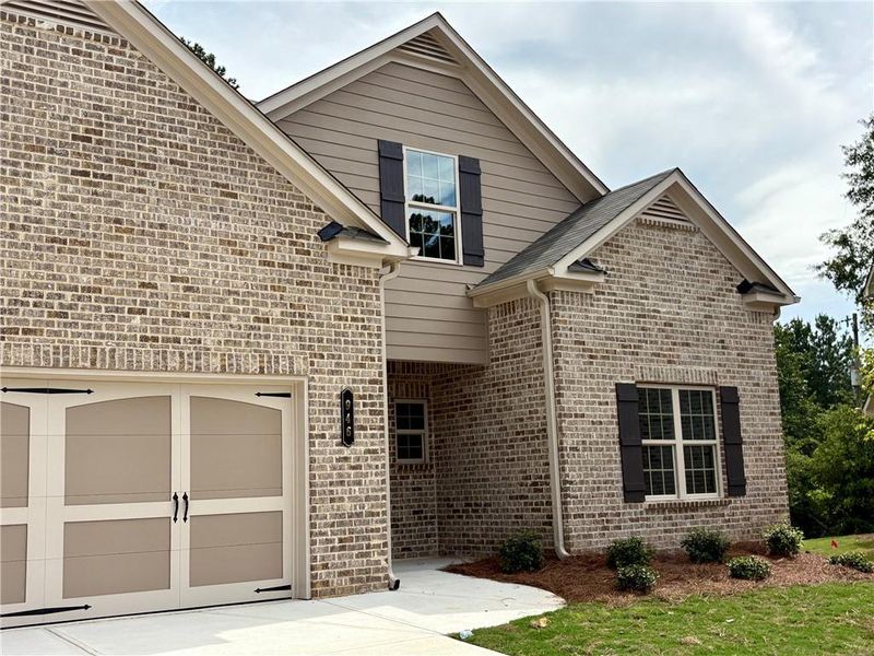 Front exterior of a new home in , Grayson, GA, highlighting curb appeal (Image 1).
