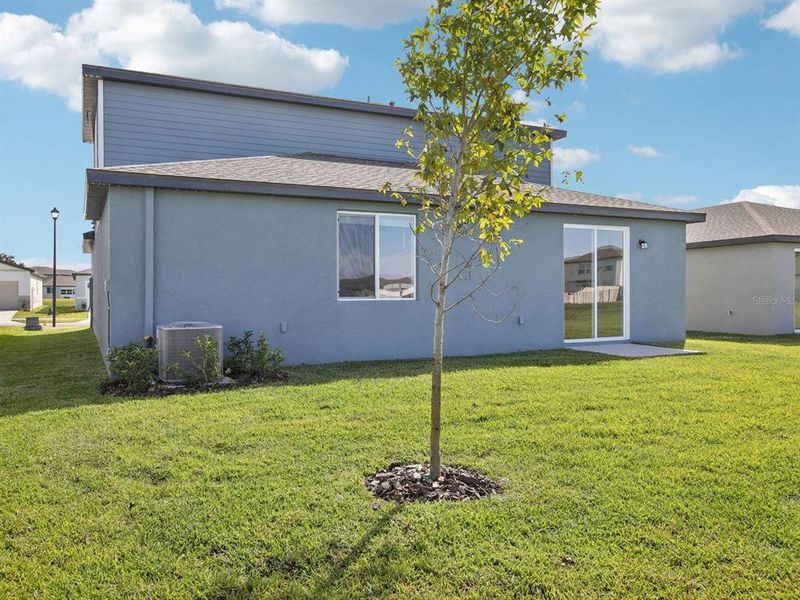 Exterior details and patio area of a home in The Grove at Stuart Crossing - Classic Series, Bartow (Image 24).