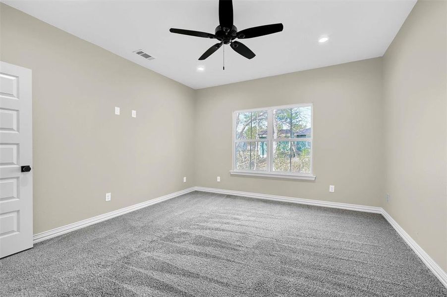 Unfurnished room with carpet flooring and ceiling fan