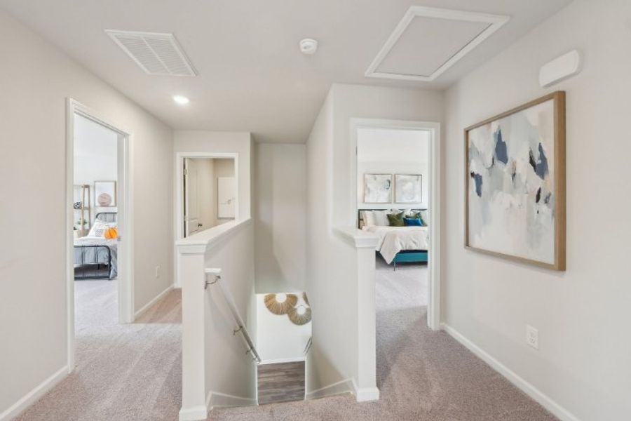 A room with a bed and a desk.