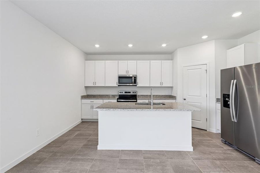 Furnished interior view inside a new home in Flagler Village - Signature Series, Palm Coast (Image 6). Furnished interior view inside a new home in Flagler Village - Signature Series, Palm Coast (Image 6).