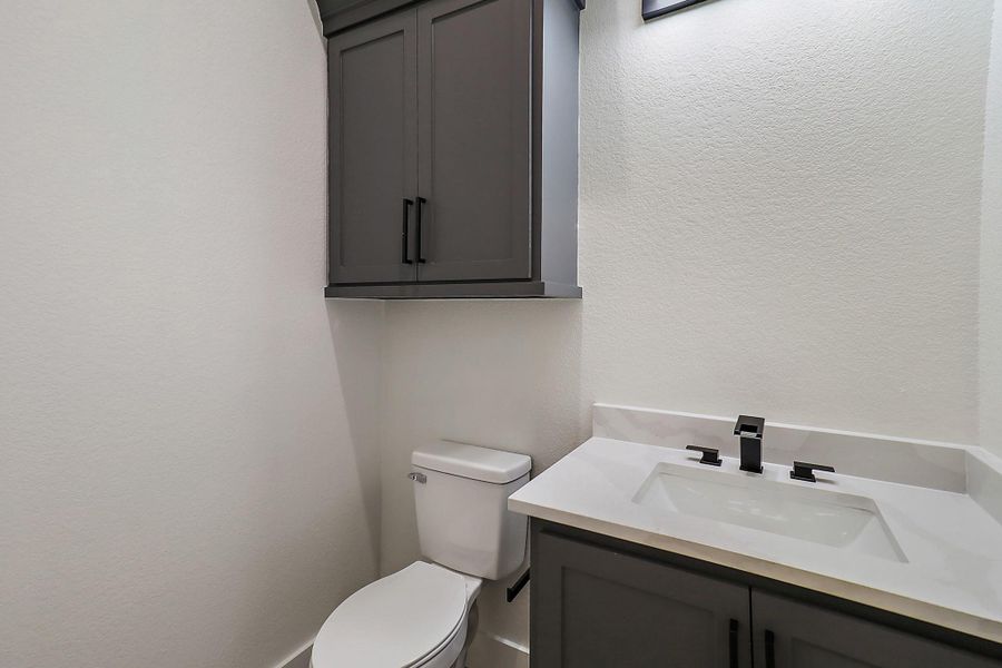 Half bathroom by the garage and mudroom Half bathroom by the garage and mudroom