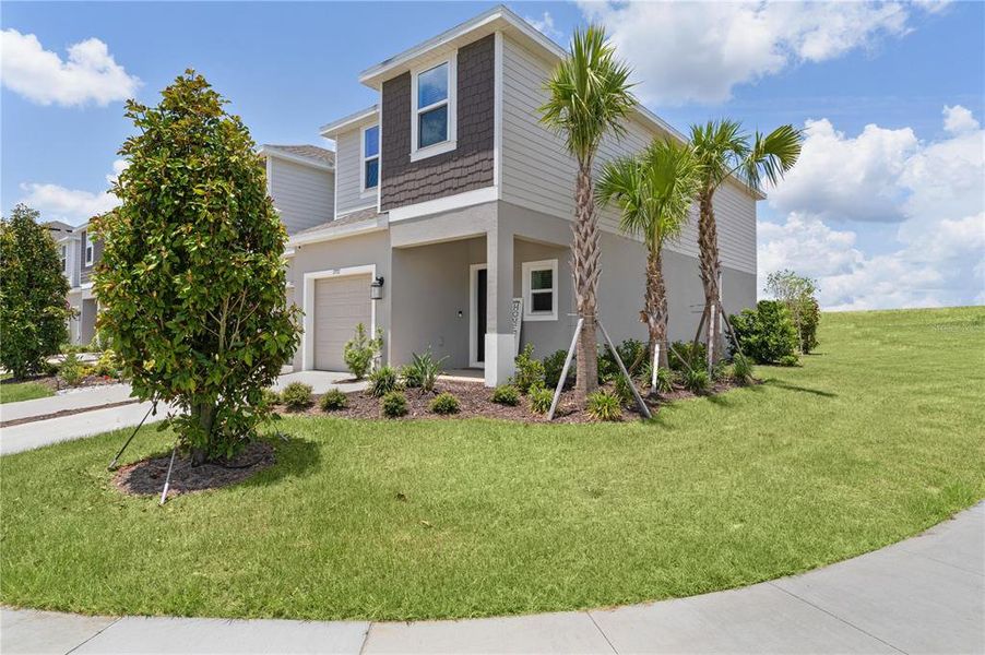 Front exterior of a new home in Waterstone, Groveland, FL, highlighting curb appeal (Image 25).