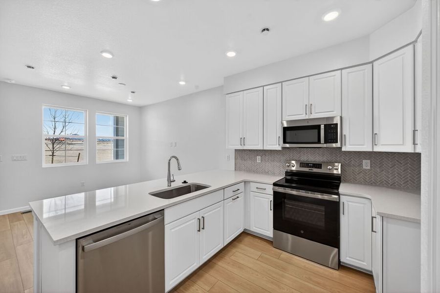 Furnished interior view inside a new home in Trailstone, Arvada (Image 5).