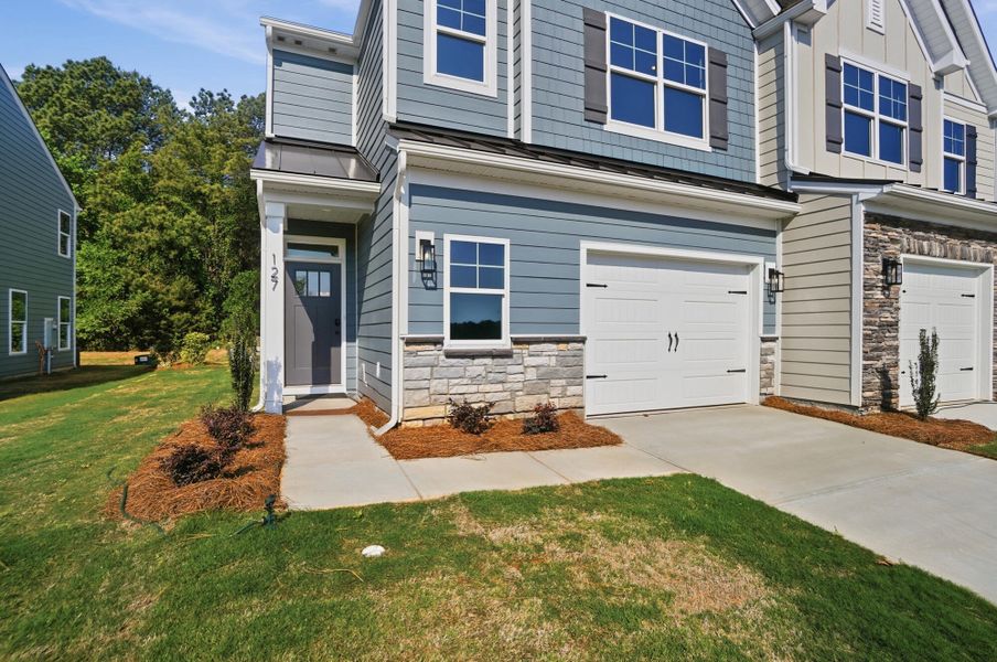Exterior details and patio area of a home in Blythe Mill Townhomes, Waxhaw (Image 2).
