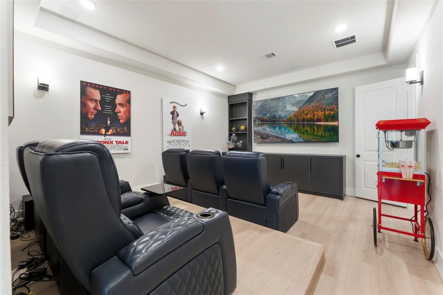 This downstairs media room...yes downstairs..creates a dedicated space for movie nights, game day, or family entertainment. Its separation from the main living area gives the home another high function gathering zone.