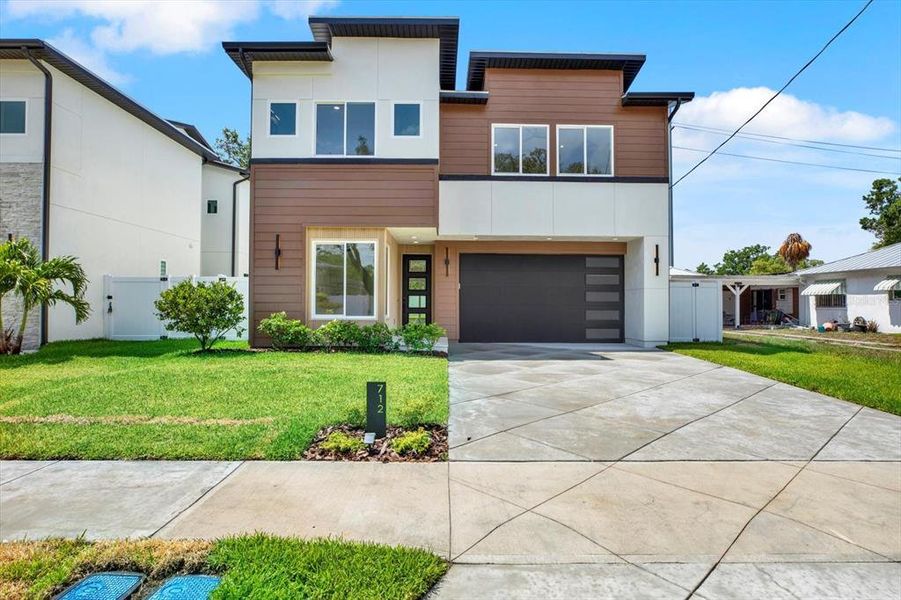Front exterior of a new home in , Tampa, FL, highlighting curb appeal (Image 1). Front exterior of a new home in , Tampa, FL, highlighting curb appeal (Image 1).