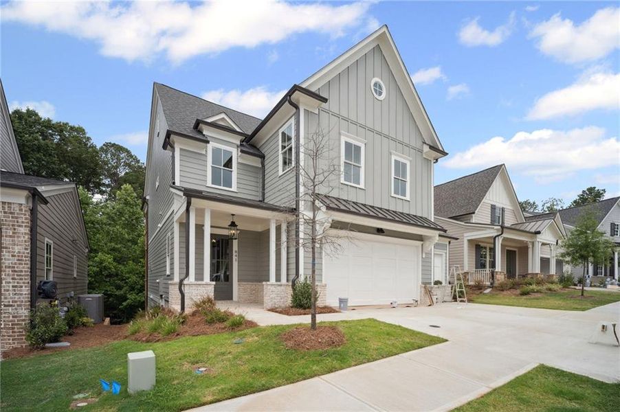 Front exterior of a new home in Lakeside at River Green, Canton, GA, highlighting curb appeal (Image 13).
