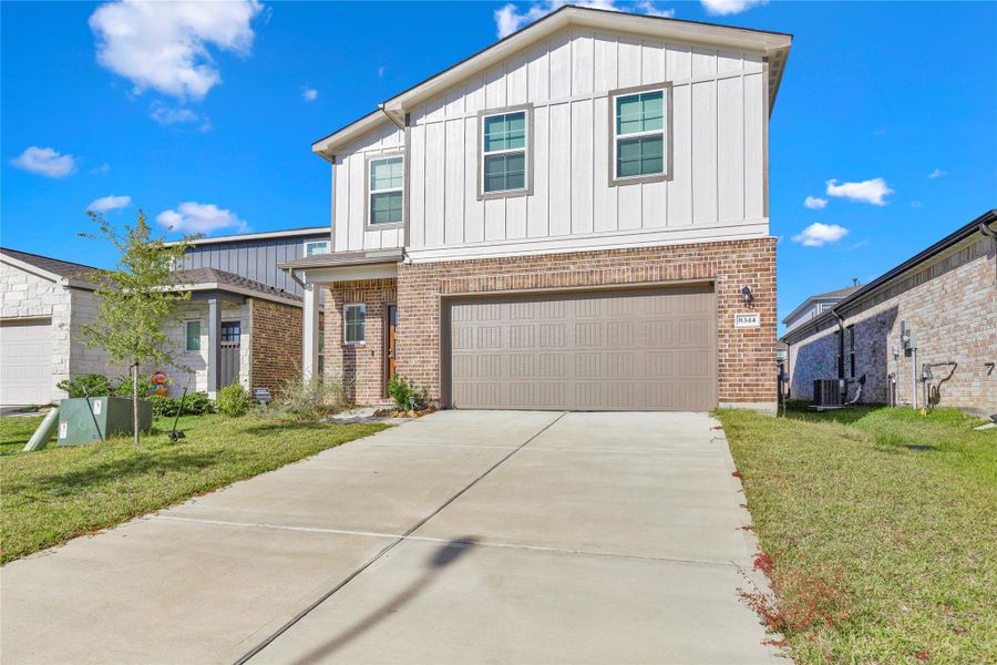 Front exterior of a new home in , Magnolia, TX, highlighting curb appeal (Image 21).