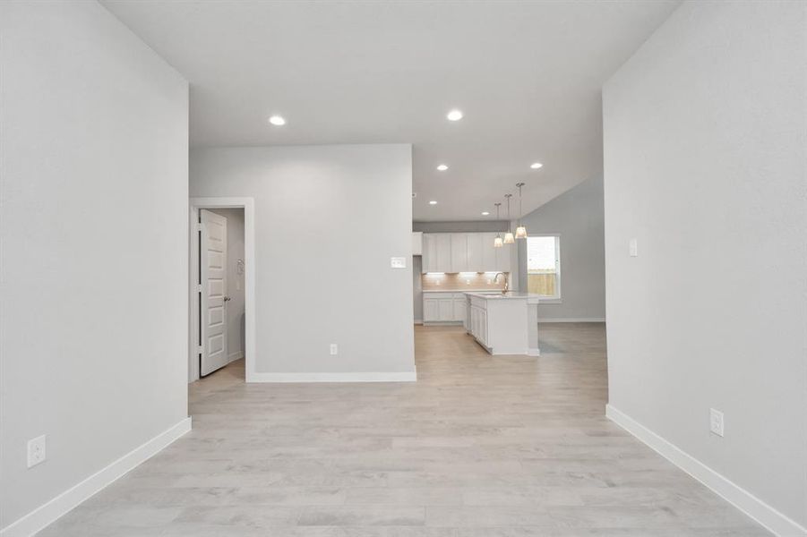 View from the dining space. Sample photo of completed home with similar plan. As built color and selections may vary.