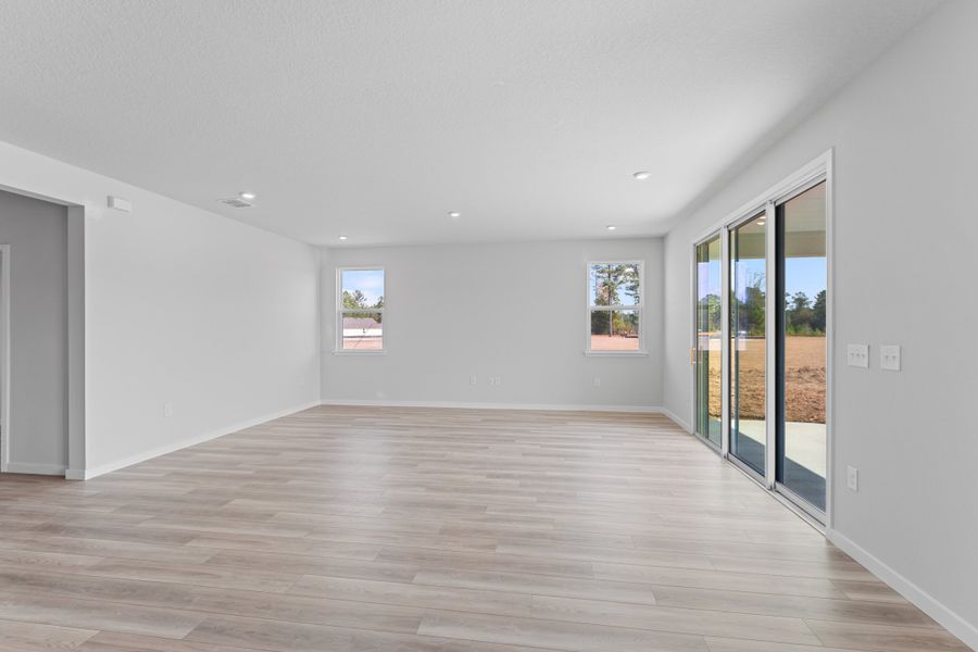 Lot 596 Open Living Area with Sliding Doors to Covered Patio at NorthShore