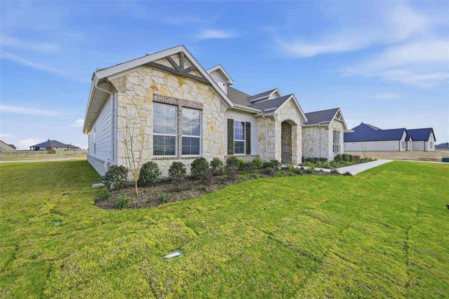 Front exterior of a new home in Eagle Ridge Estates, Weatherford, TX, highlighting curb appeal (Image 19).