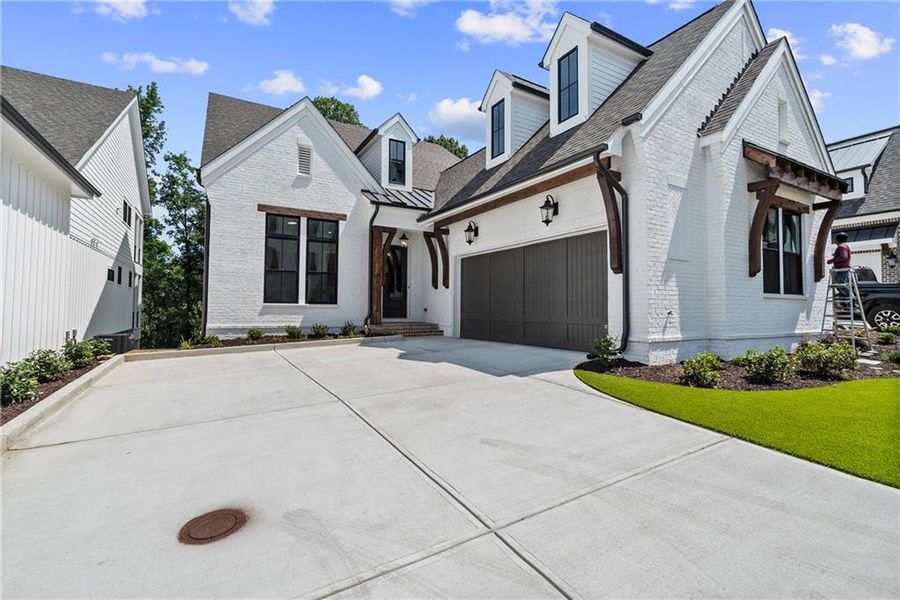 Front exterior of a new home in Waterside Single Family, Peachtree Corners, GA, highlighting curb appeal (Image 25).