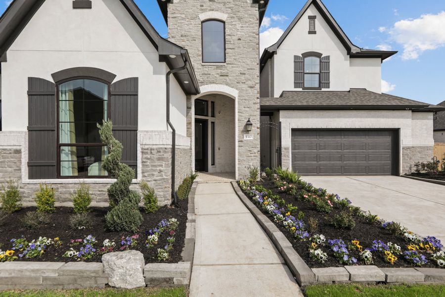 Front exterior of a new home in Fulbrook on Fulshear Creek 60', Fulshear, TX, highlighting curb appeal (Image 2).