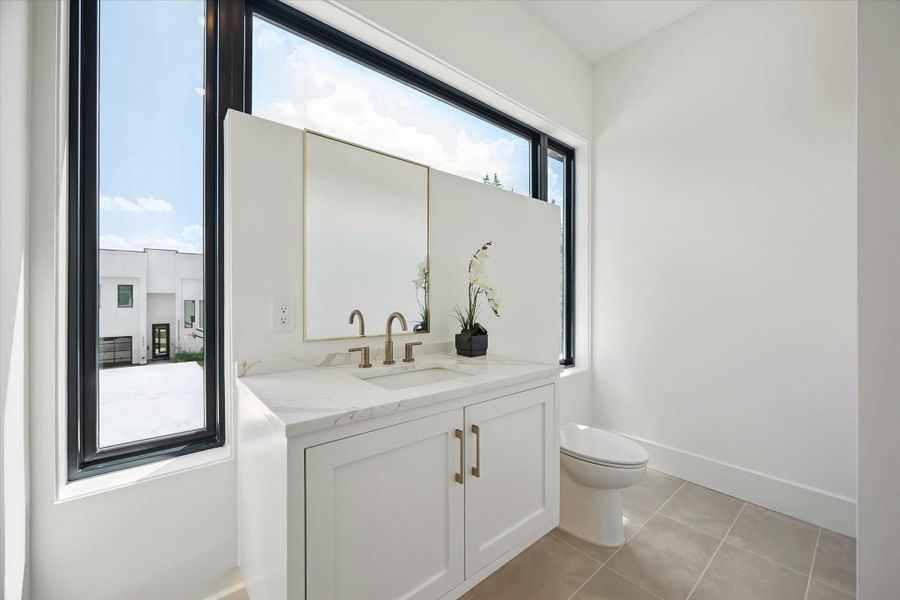 Beautiful powder bathroom conveniently integrated into the media room. Beautiful powder bathroom conveniently integrated into the media room.