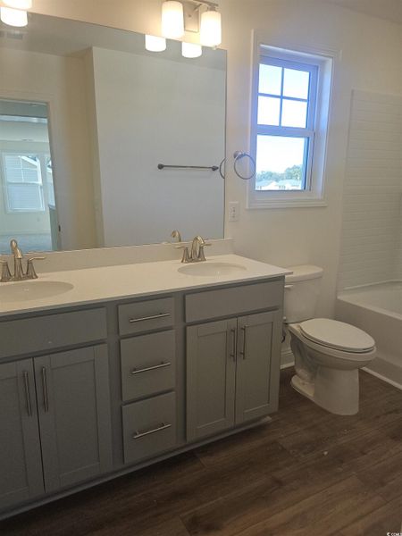 Upstairs Bathroom featuring double vanity  and  shower combination