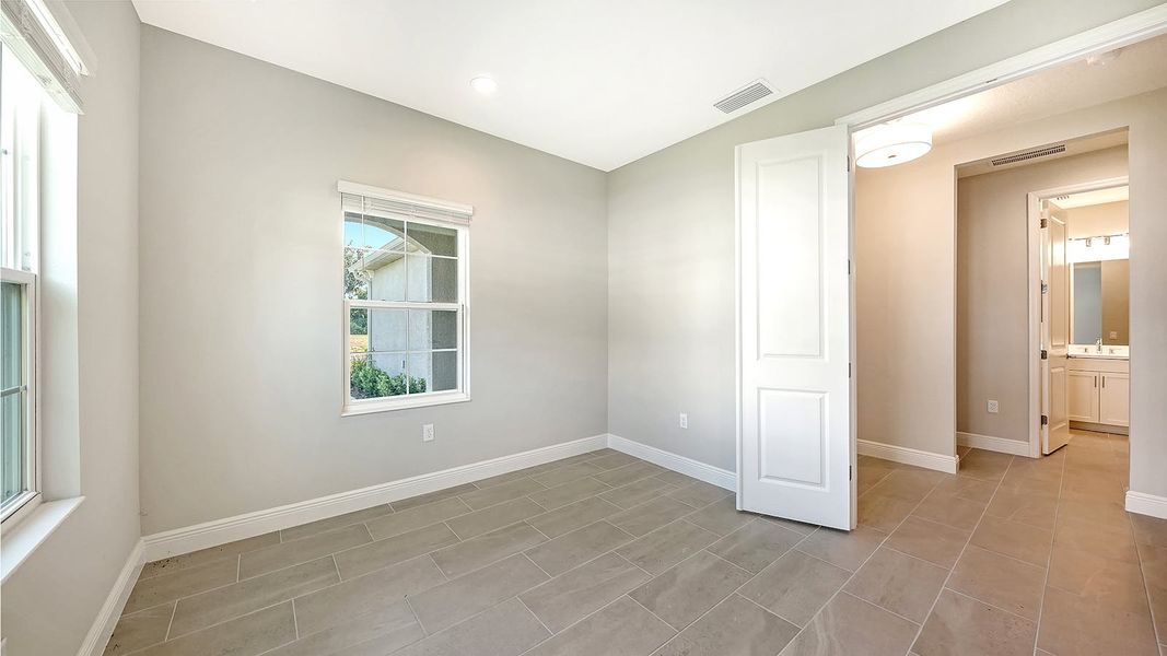 Spacious, unfurnished interior of a new home in Wildleaf Real Estate and Homes for Sale in Parrish, FL - Neal Communities, Parrish (Image 27).